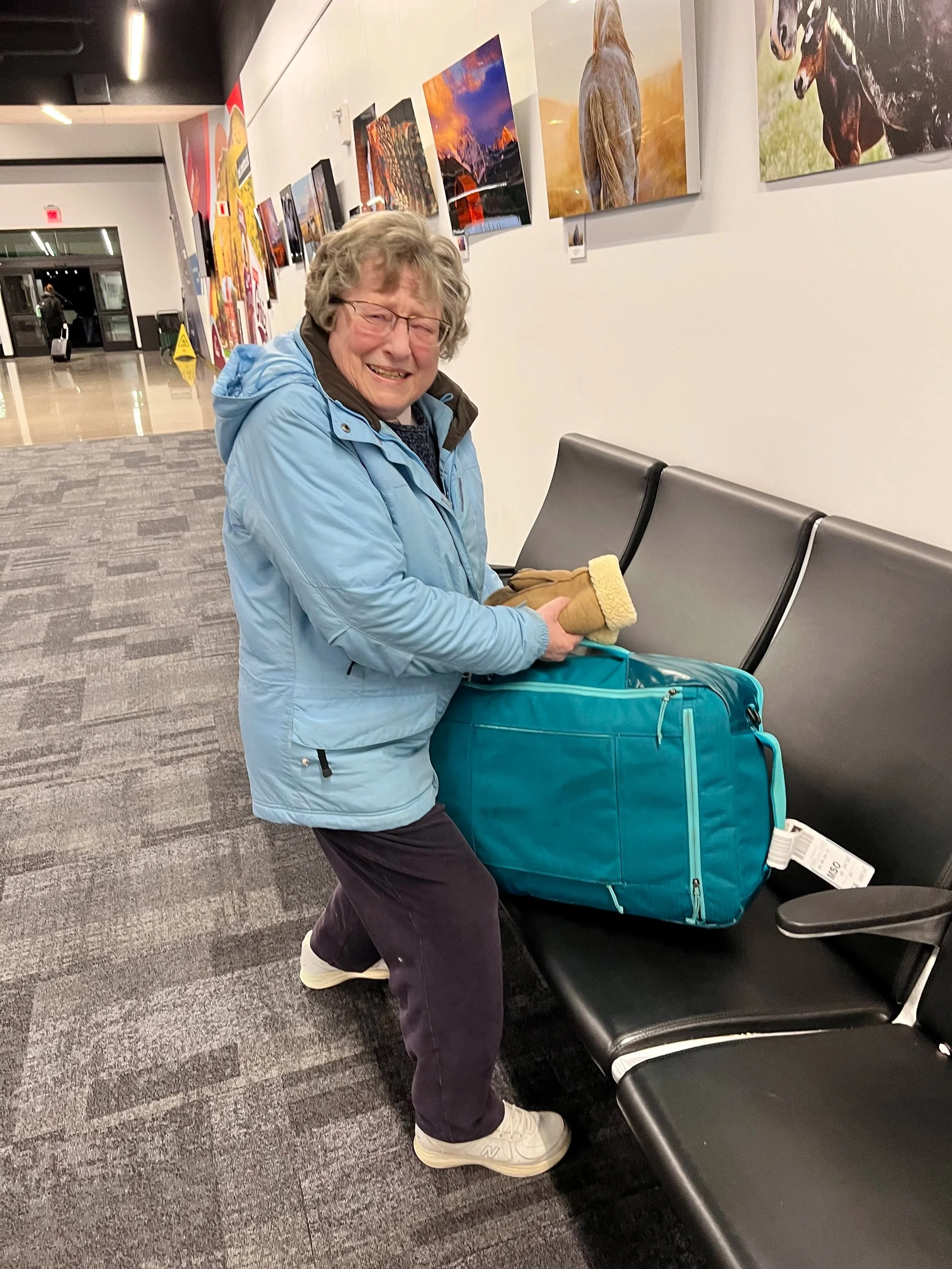 Woman struggling to steal a suitcase