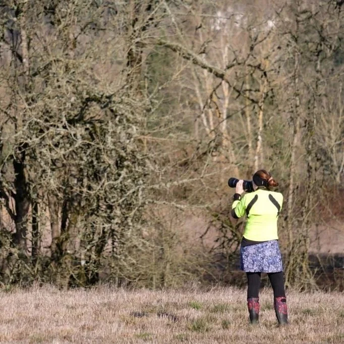Michelle taking photos of birds with her telephoto lens.
