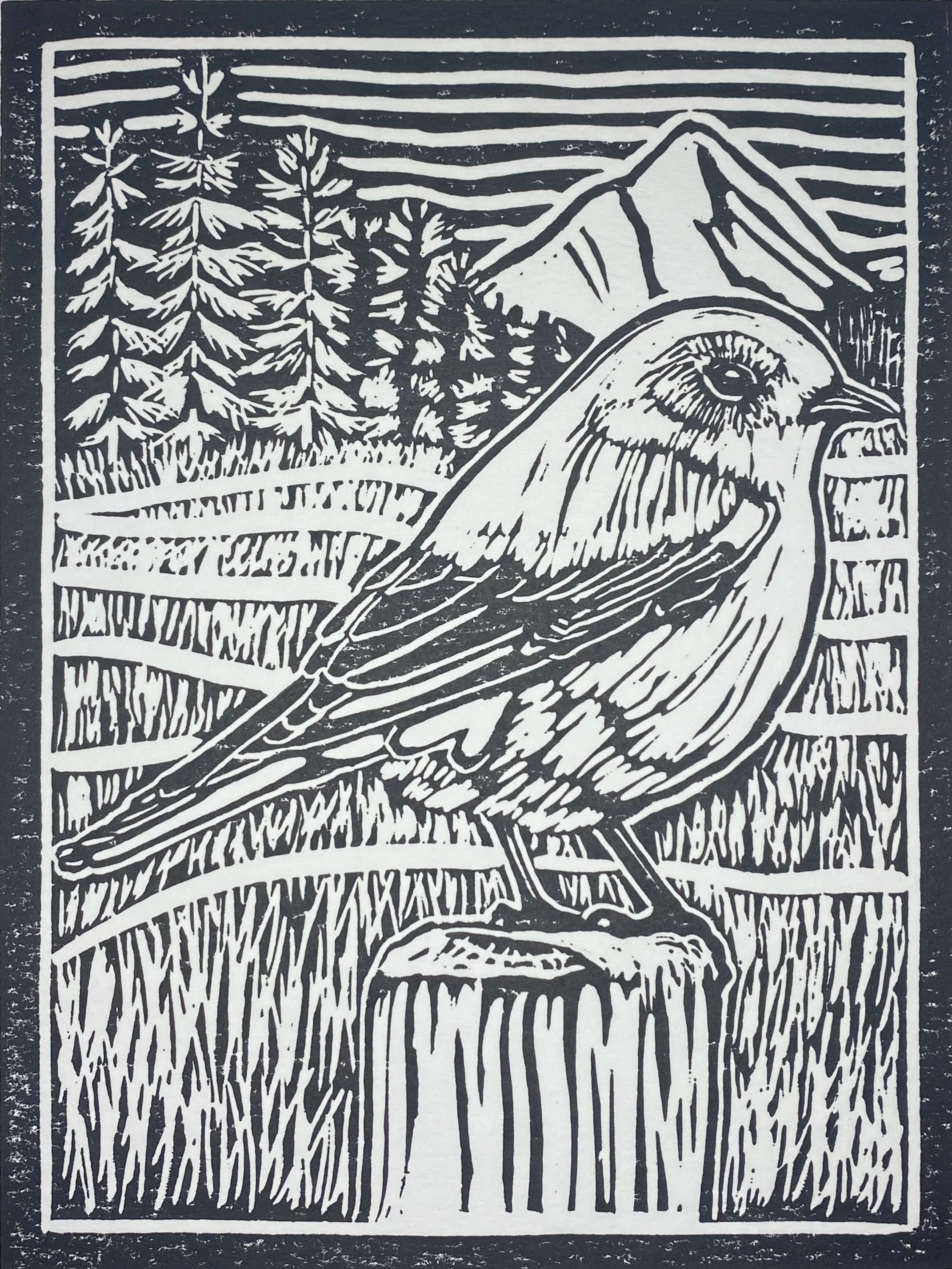A black and white linocut print of a mountain landscape with tall pine trees and a bird perched on a branch in the foreground.