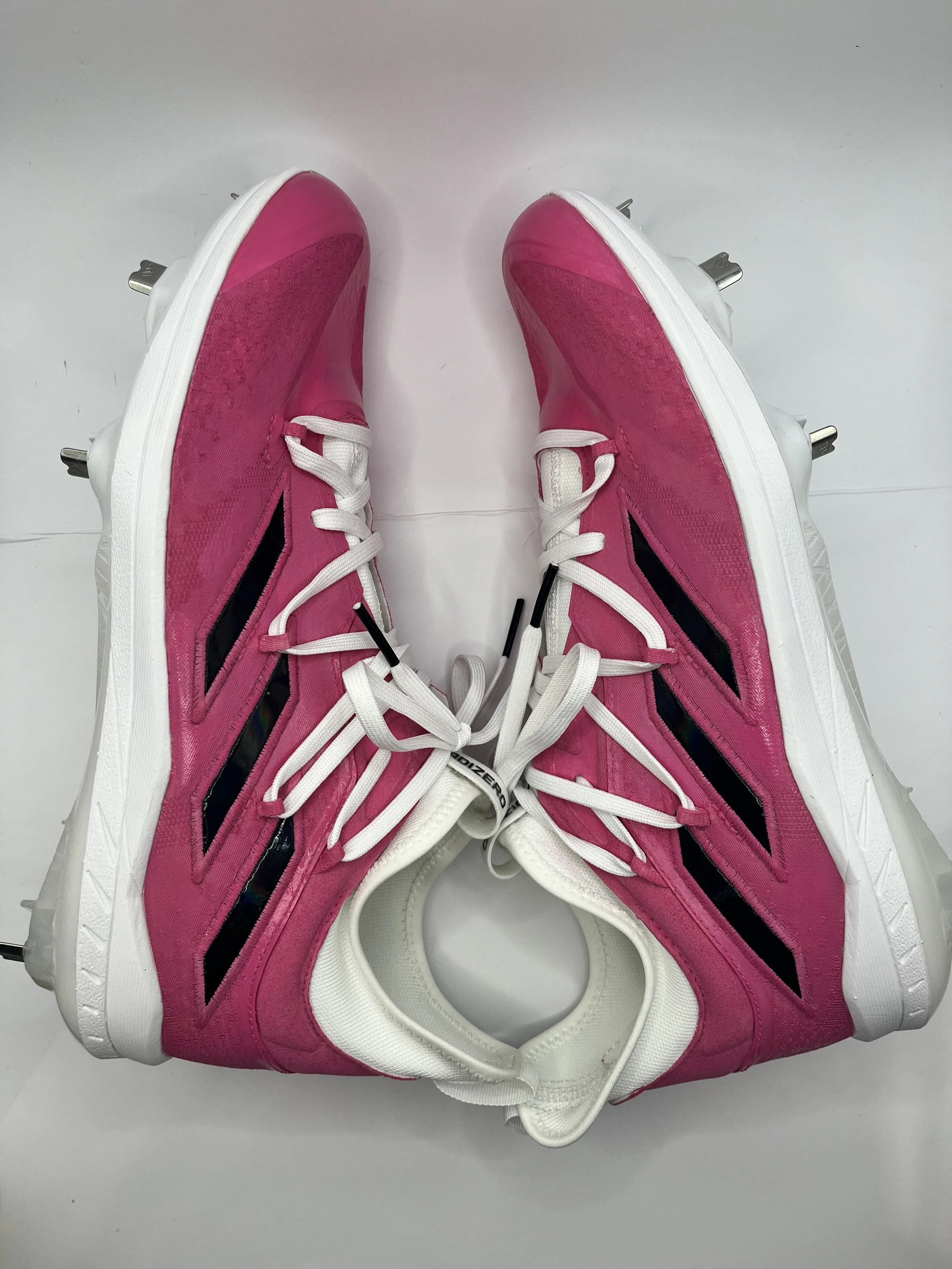 Pair of pink and white athletic sneakers with black accents on a white background.
