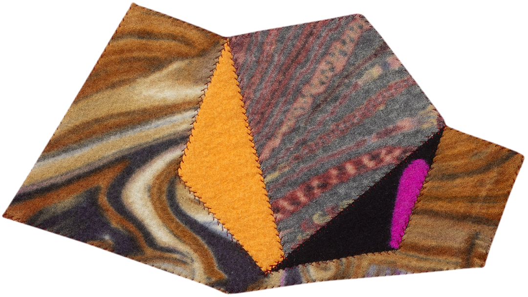 image of geometric textile artwork with multiple colors and patterns including tones of yellow, gold, and pink