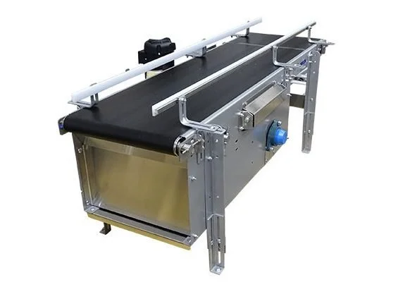 Blue incline belt conveyor with Z-frame elevation change in a production facility