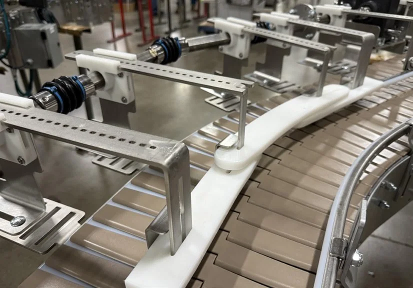 Flat belt conveyor with black belt on stainless steel frame for general transportation