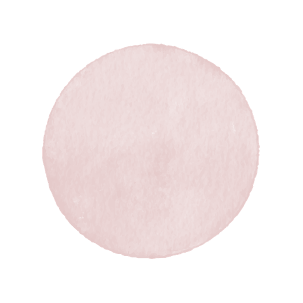 A close-up view of a pink, round cotton pad.
