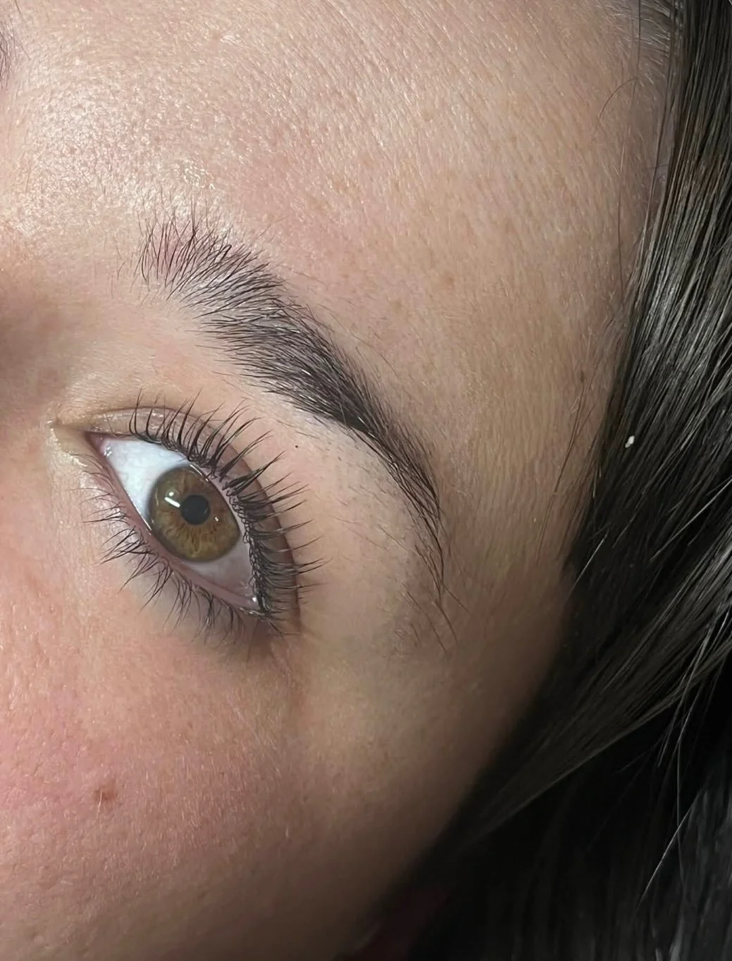 Close-up of a person's left eye with detailed view of eyelashes, eyebrow, and surrounding skin. Award winning Lisa B Hair and Beauty Salon in Carlisle, Cumbria UK.