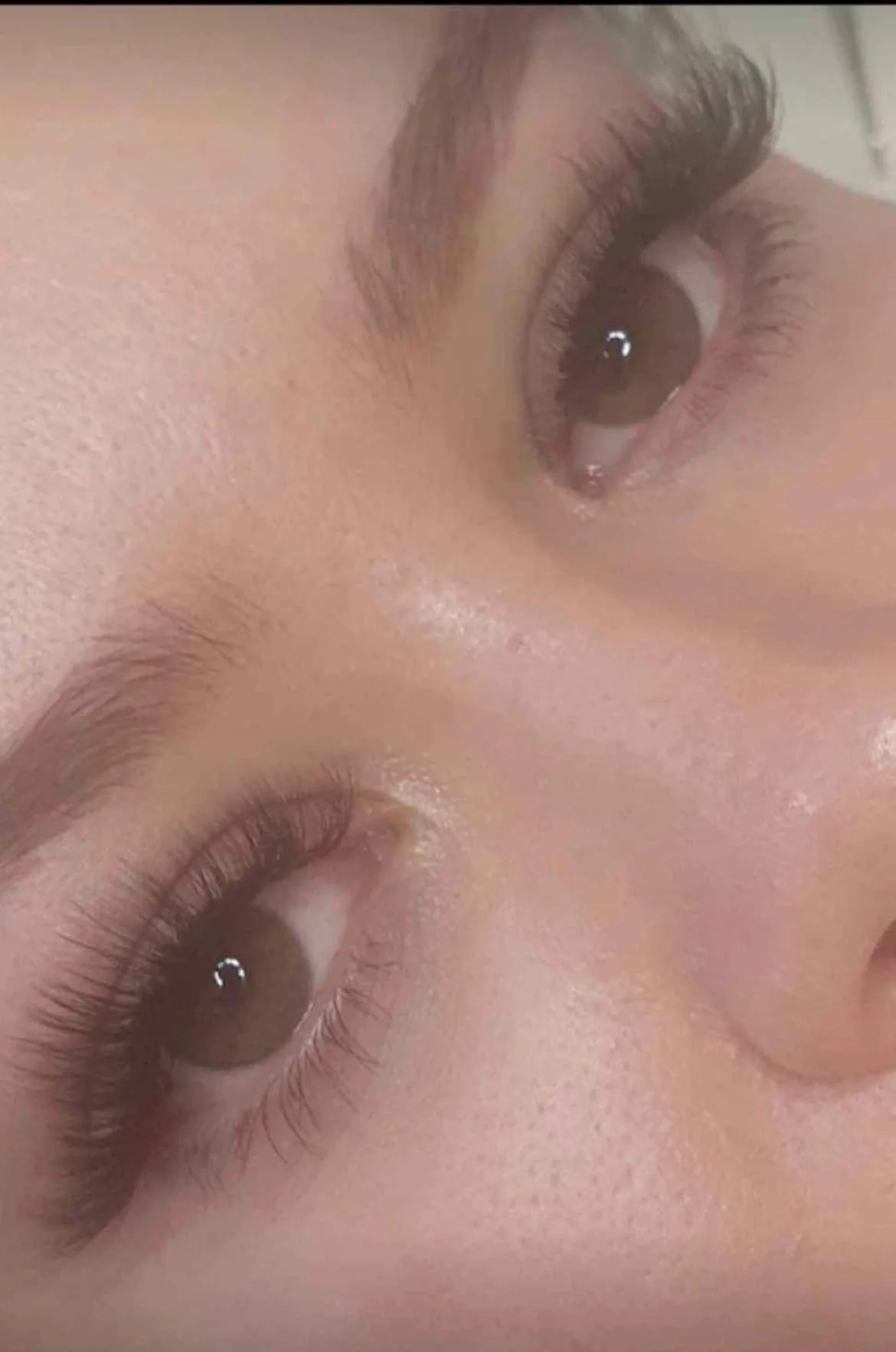 Close-up of a person's face with focus on brown eyes, eyebrows, and skin texture. Lisa B Hair & Beauty Salon, Carlisle, Cumbria UK.