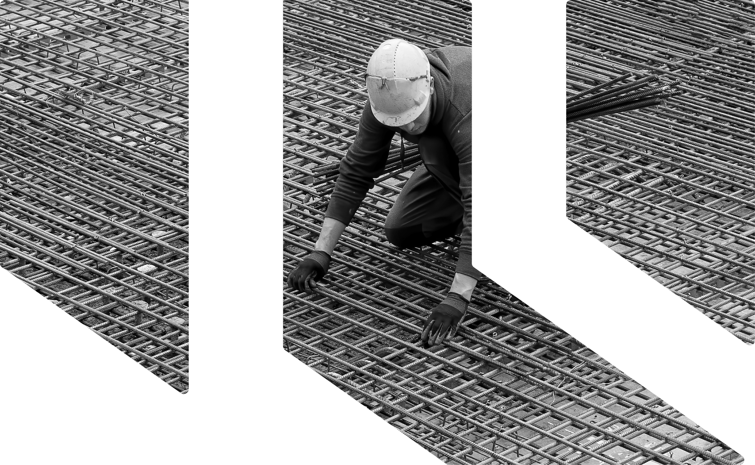 Construction worker wearing a hard hat and gloves kneeling on a steel rebar grid at a construction site