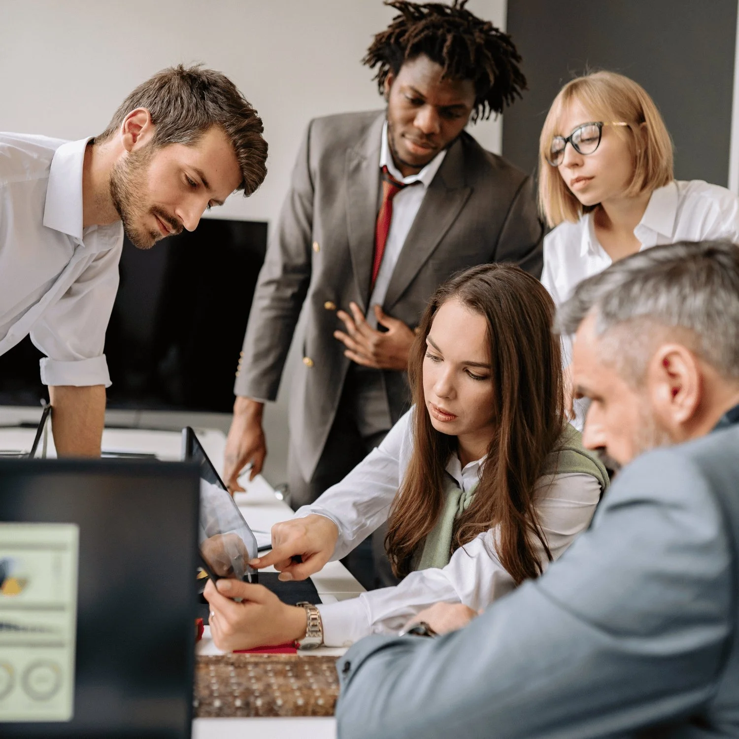 Diverse high-performing team collaborating in the office