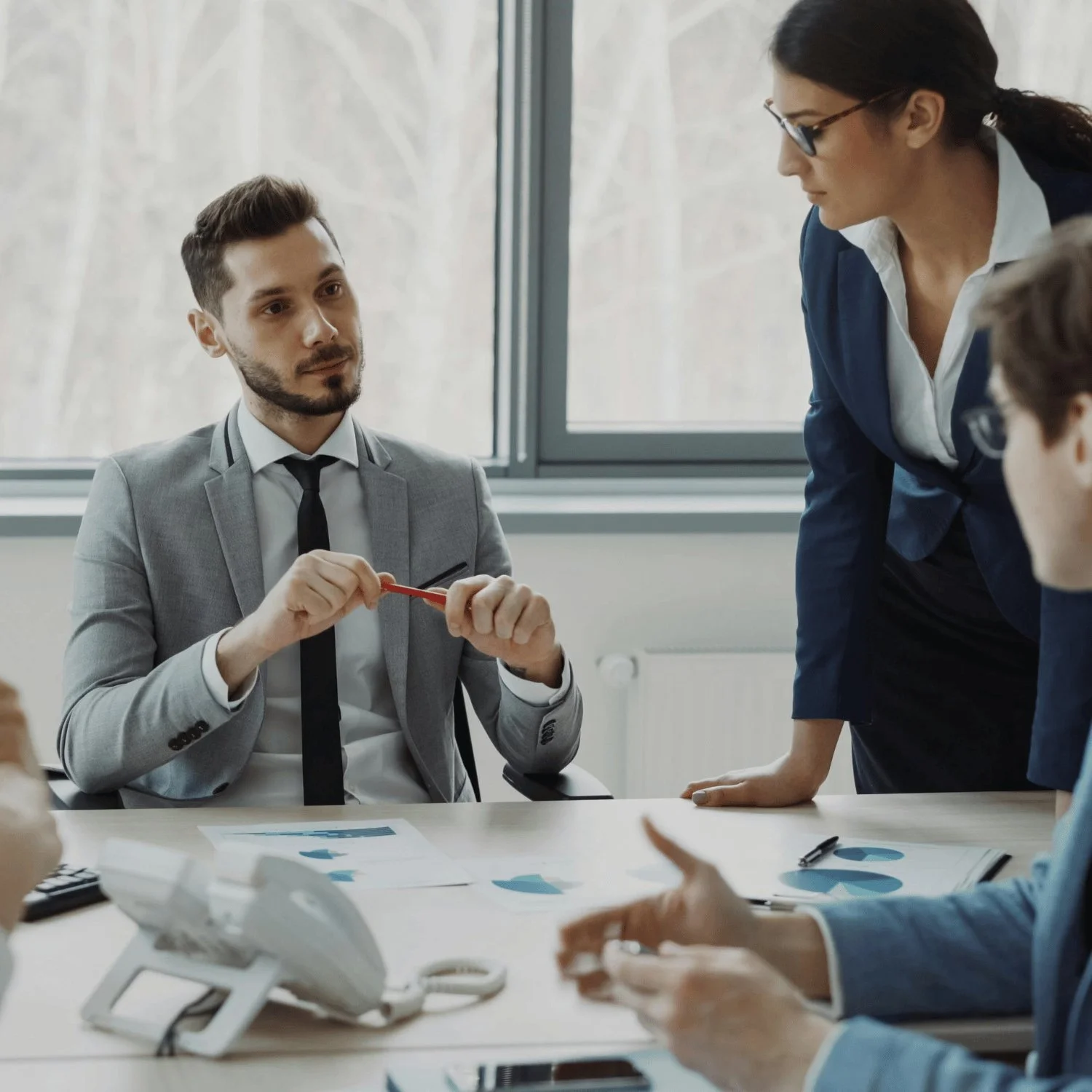 Recruiter discussing hiring strategy with a business team during a planning meeting