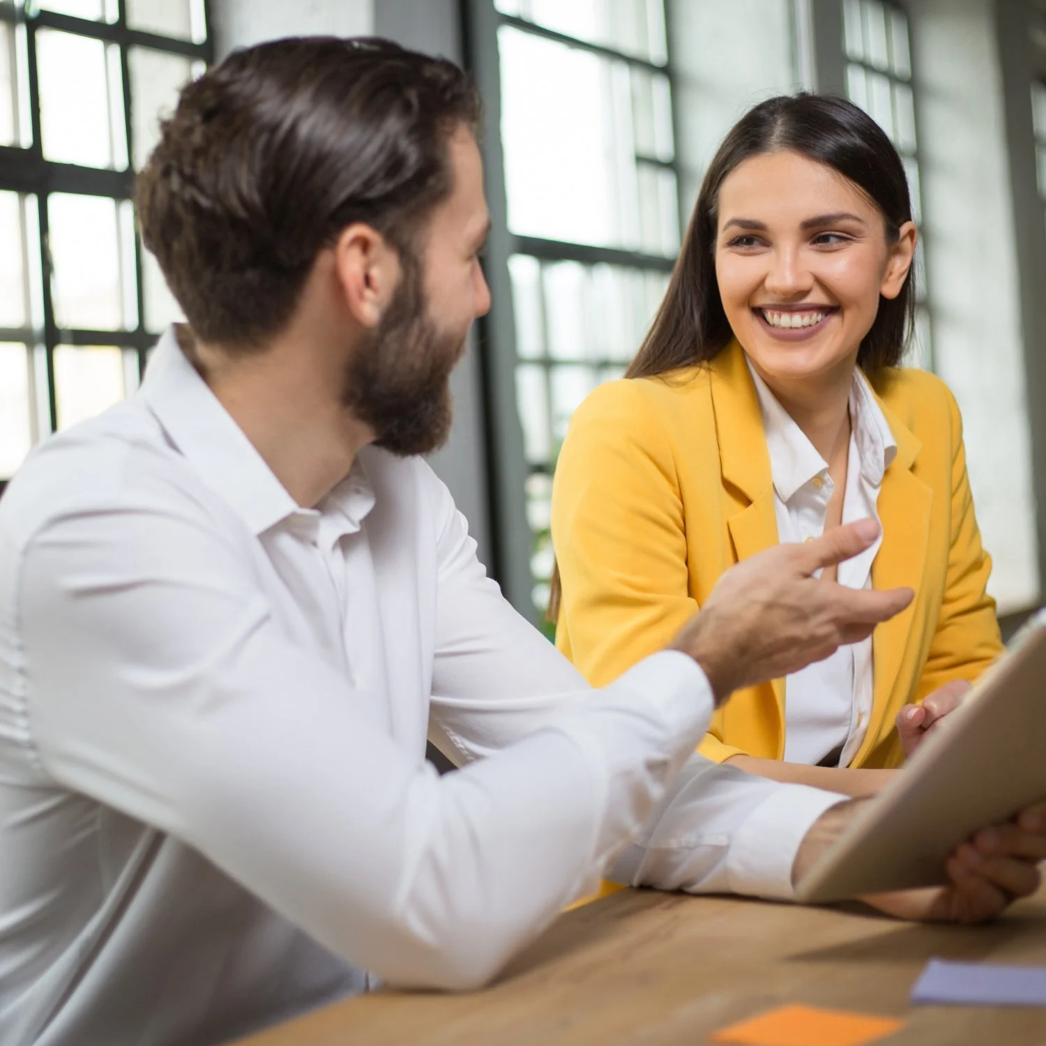 Recruiter discussing hiring needs with an employer during a consultation
