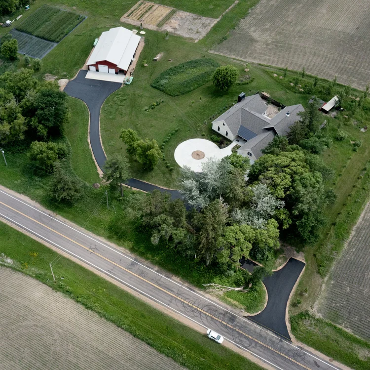 Aerial view of a newly installed asphalt driveway and approach by J&W Asphalt