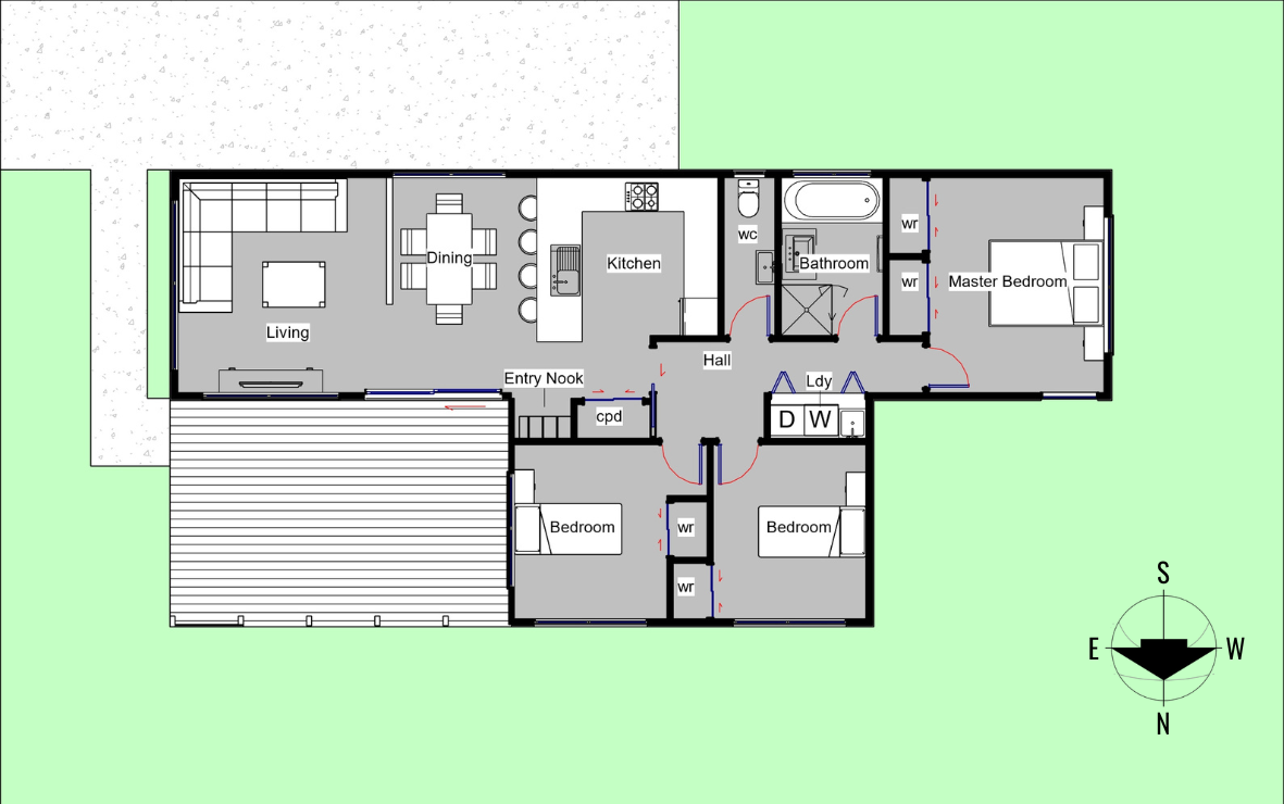 A floor plan of a house showing a living room, dining area, kitchen, entry nook, hall, three bedrooms, two bathrooms, laundry room, and deck, with a compass indicating north.