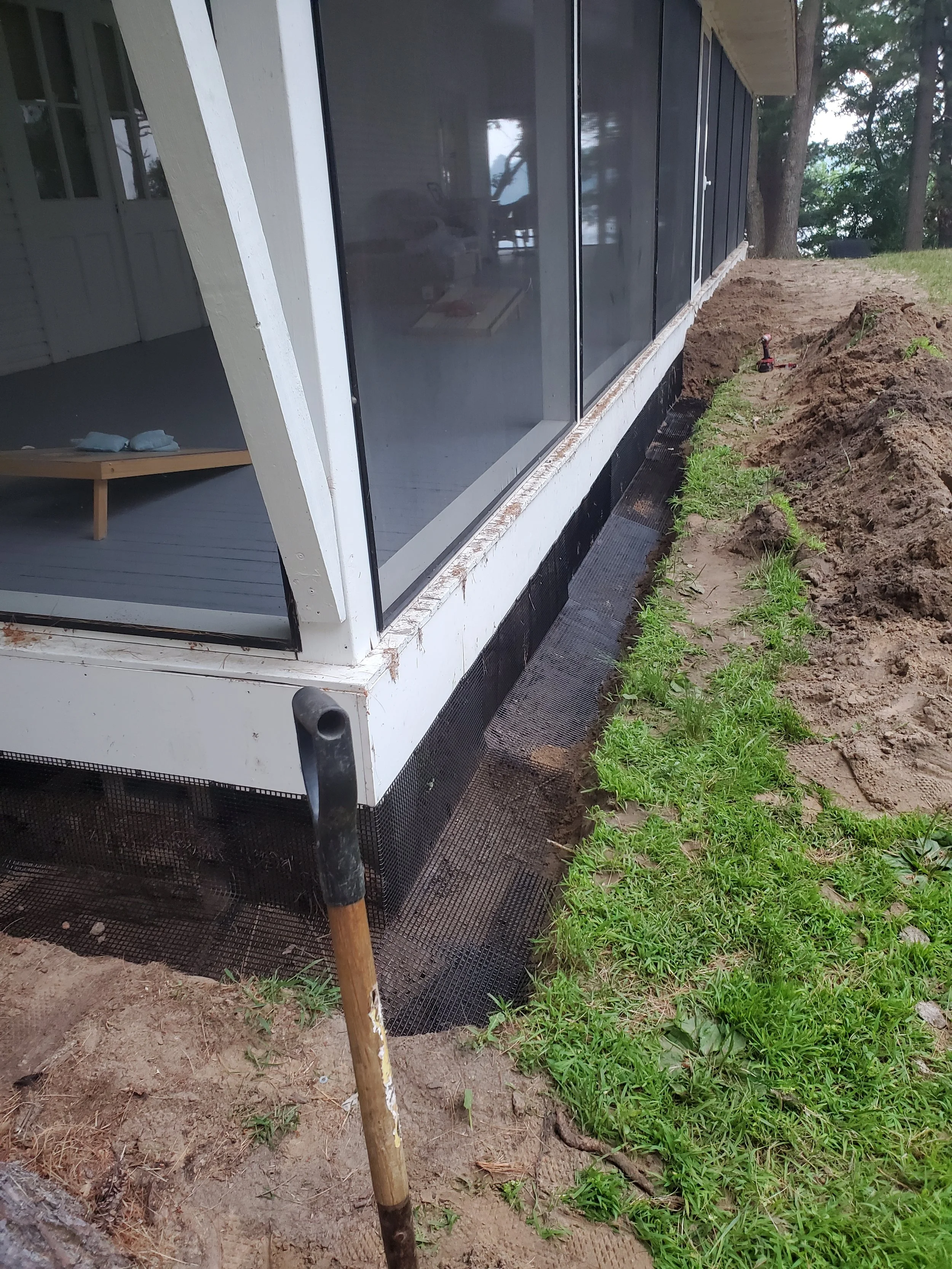 Buried wire exclusion done to keep critters out from underneath this client's wrap around screen porch.