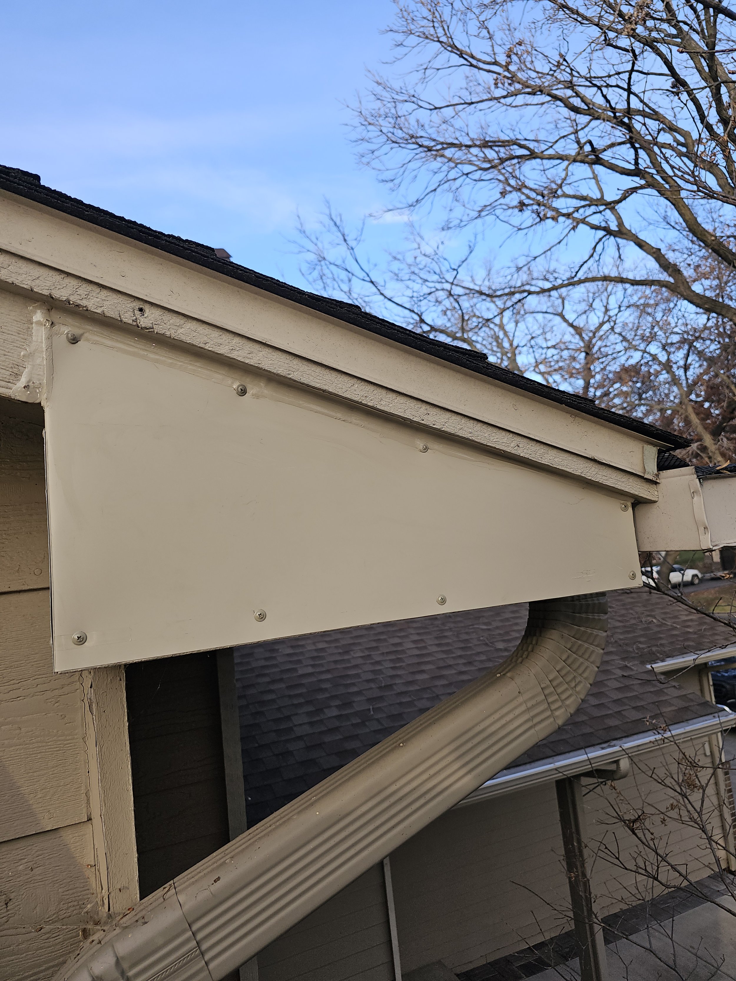 Coil stock metal patch done on soffit gable corner to repair squirrel and woodpecker damage.