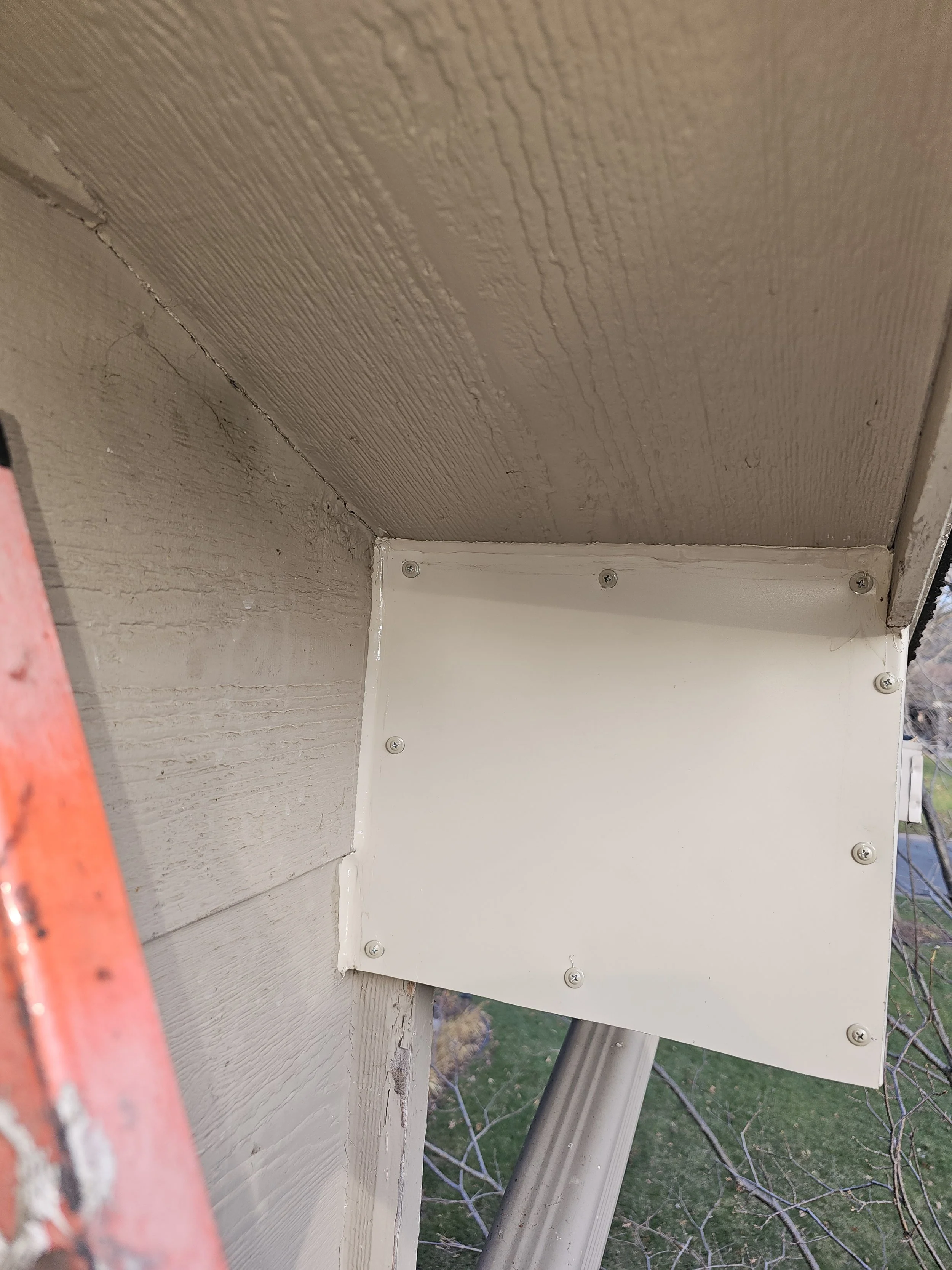 Front side of soffit gable end done with coil stock metal patch.