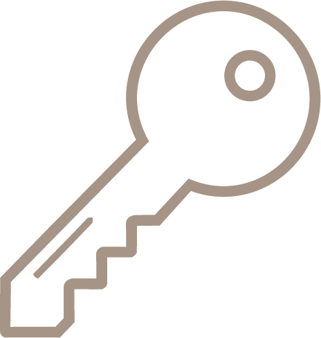 Simple line drawing of a key with a round head and jagged teeth.