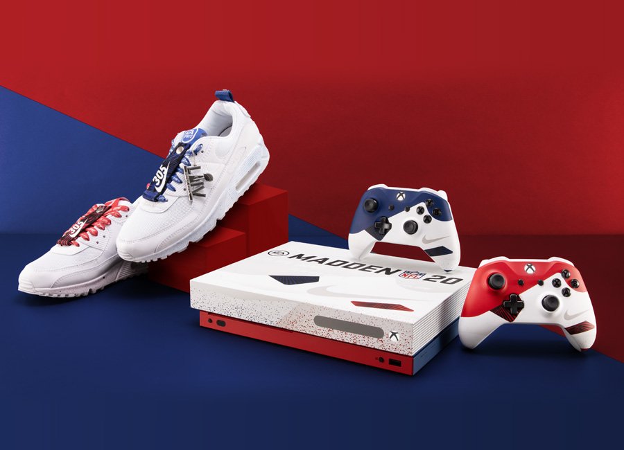 A pair of white athletic shoes with red and blue laces, a custom Xbox Series X gaming console themed for Madden NFL 20, and two Xbox controllers in red, white, and blue, all set against a red and blue background.