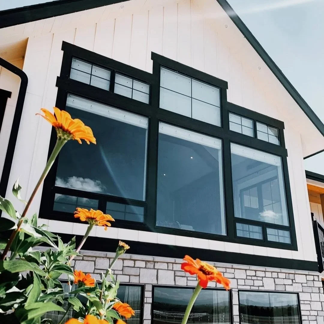 Sunflowers in front of freshly cleaned exterior windows on a Northern Colorado home