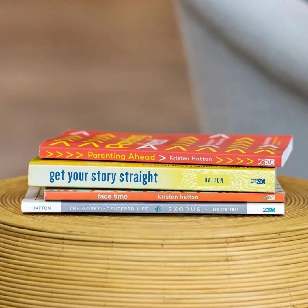 Stack of four books on a wooden surface, with titles 'Parenting Ahead,' 'Get Your Story Straight,' 'Face Time,' and 'The Gospel-Centered Life'.