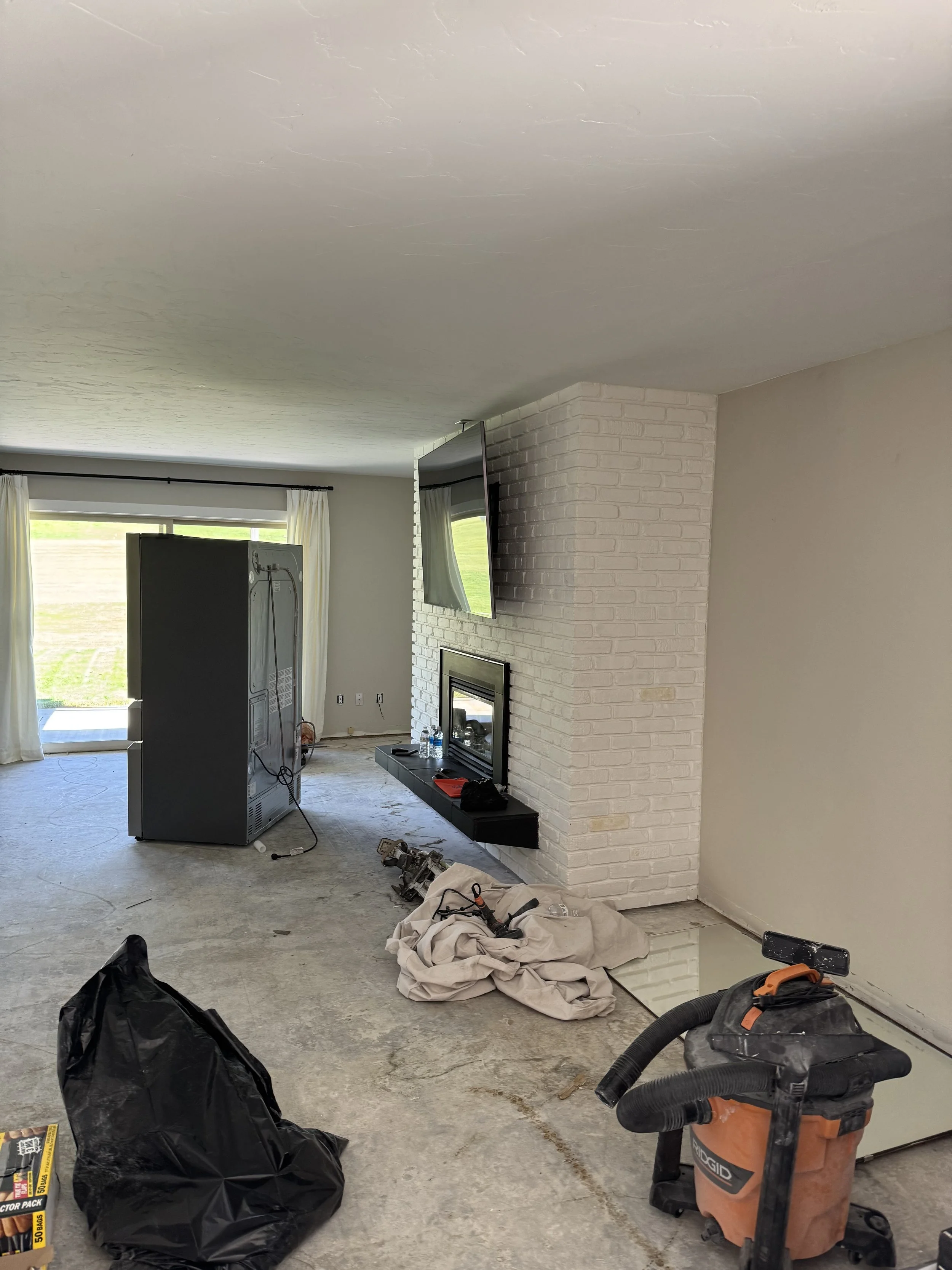 Picture taken from front door entry through living room and the living room slider door.