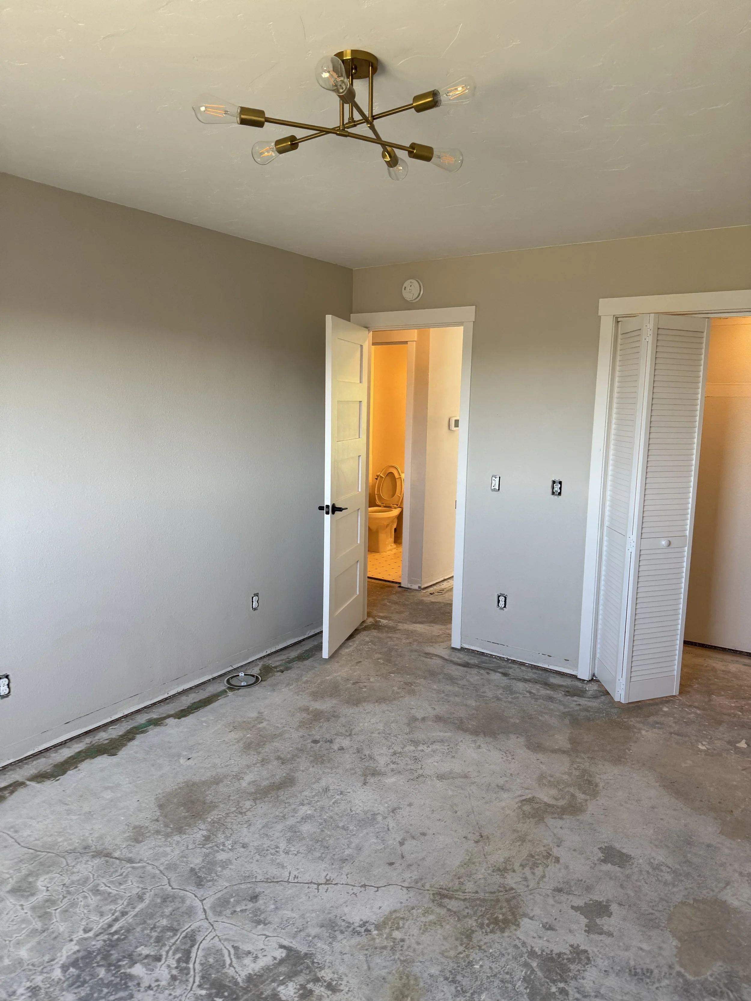 Guest bedroom entrance from room and part of closet. 