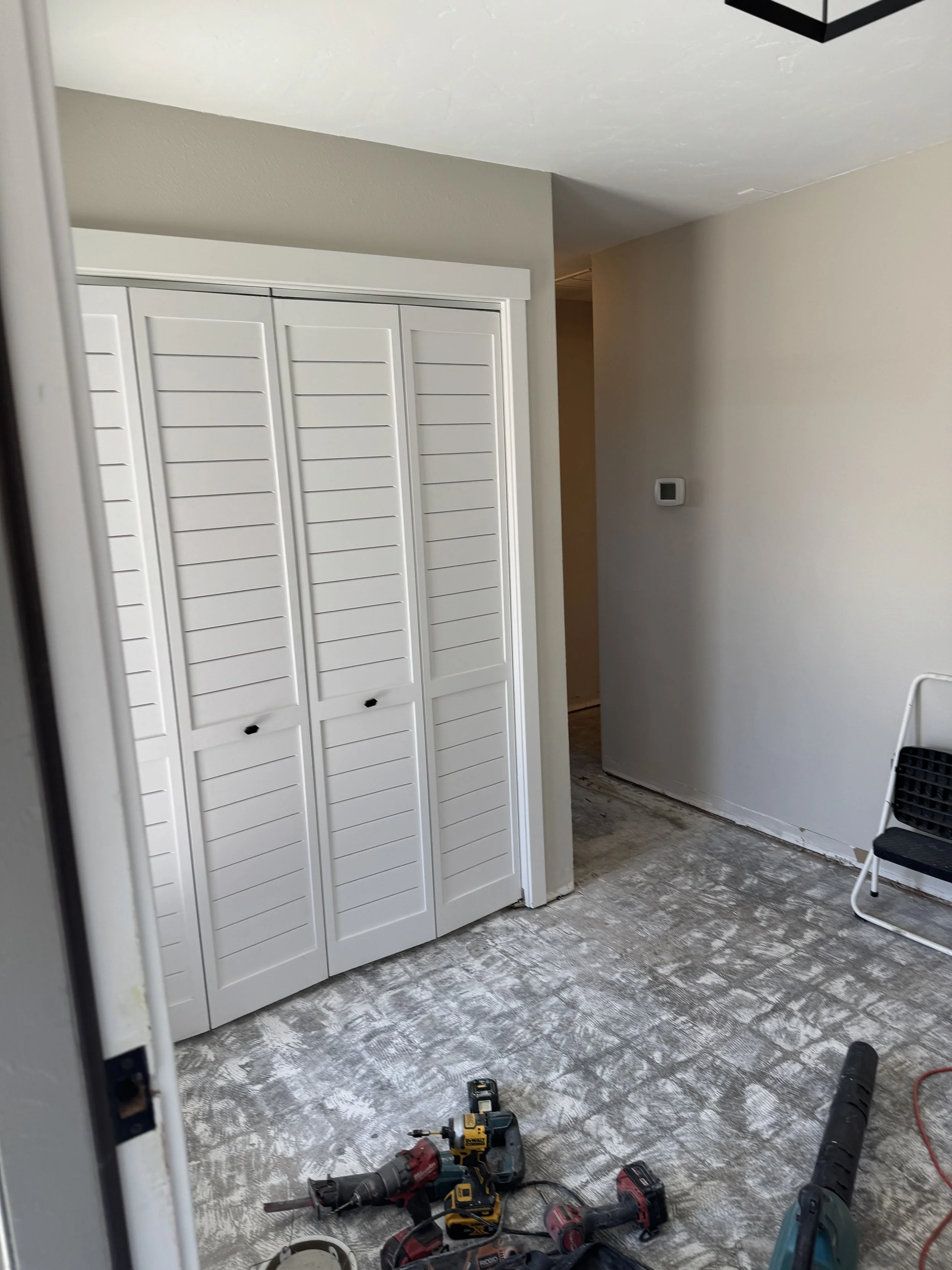 Closet and hallway on the left side of the front door entryway.