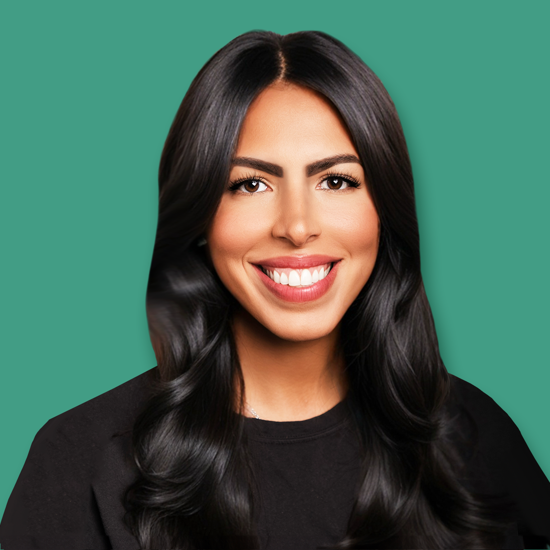 Portrait of a smiling woman with long black hair, wearing a black top, against a green background.