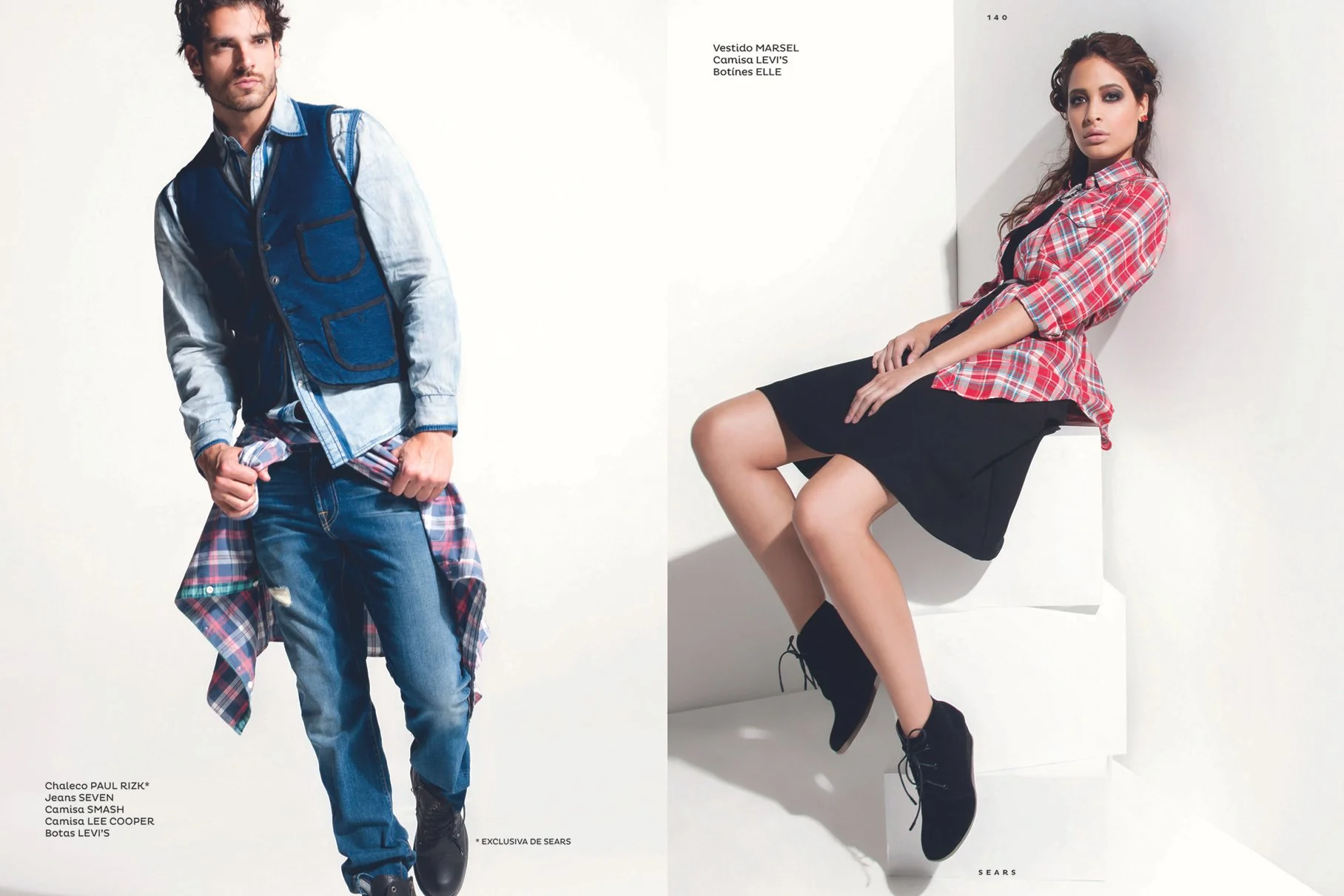 A fashion magazine spread features a male model on the left wearing a blue vest, denim jeans, a plaid shirt tied around his waist, and black boots. A female model on the right is seated against a white background, wearing a red plaid shirt, a black s