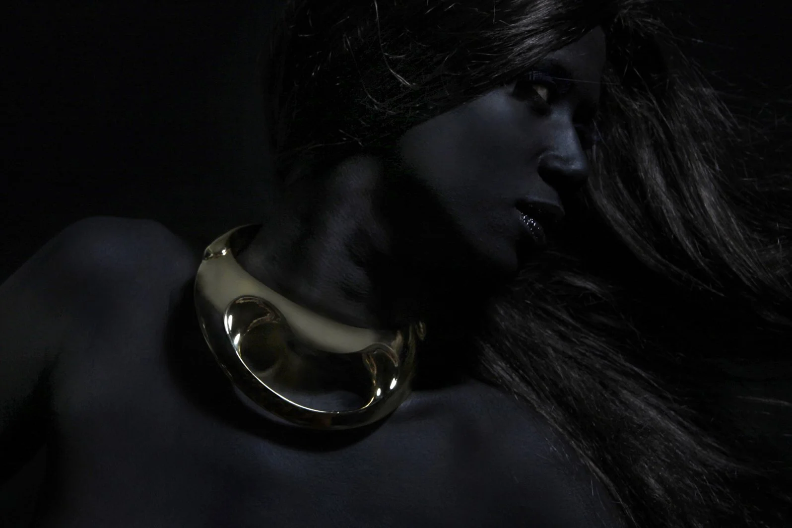 A darkly lit portrait of a woman wearing a large gold choker necklace, with her face partially obscured by shadows and her long hair.