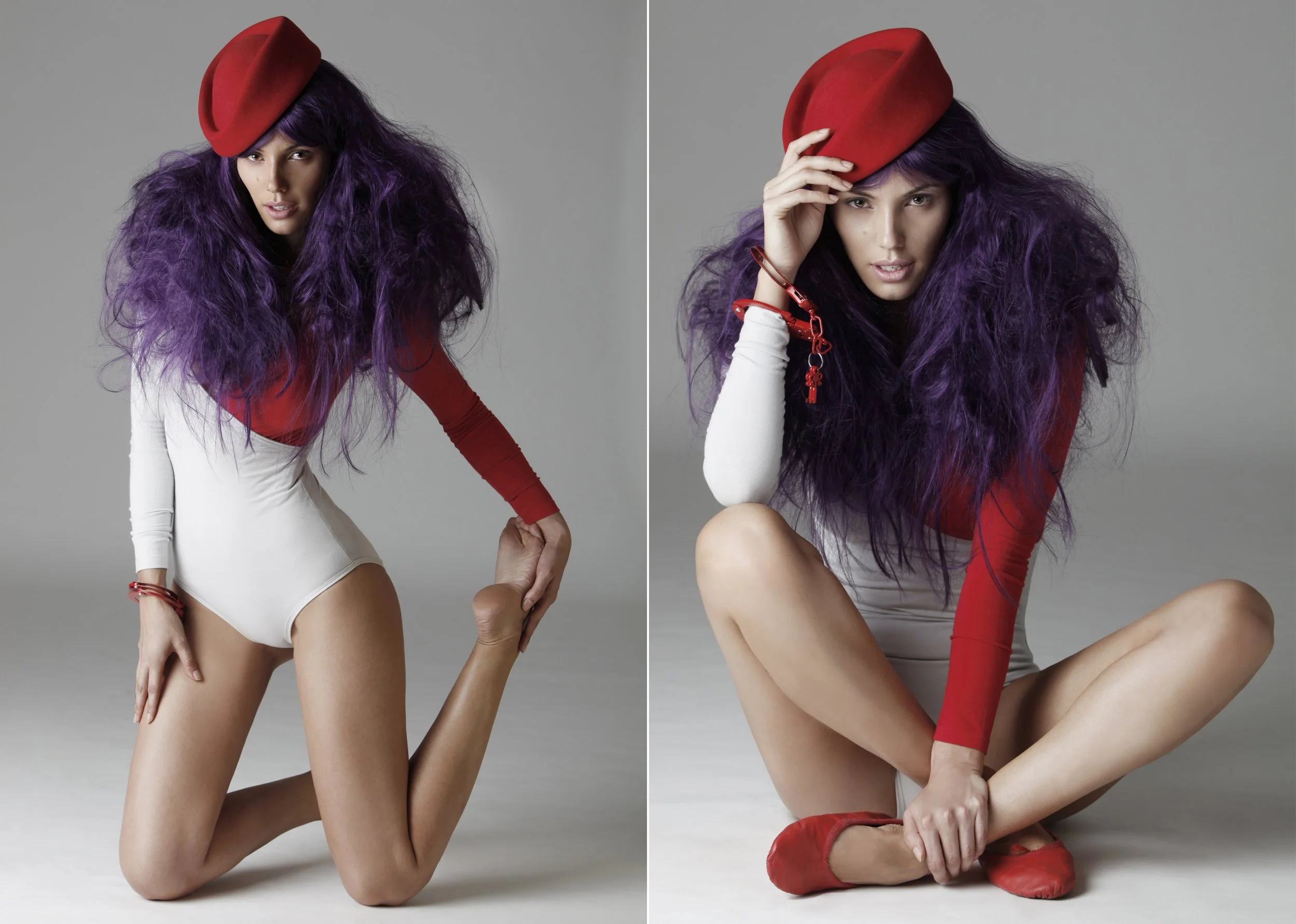 A woman with long, curly purple hair, wearing a red beret, a red long sleeve top, and white high-waisted underwear, posing with her hand on her hip against a gray background.