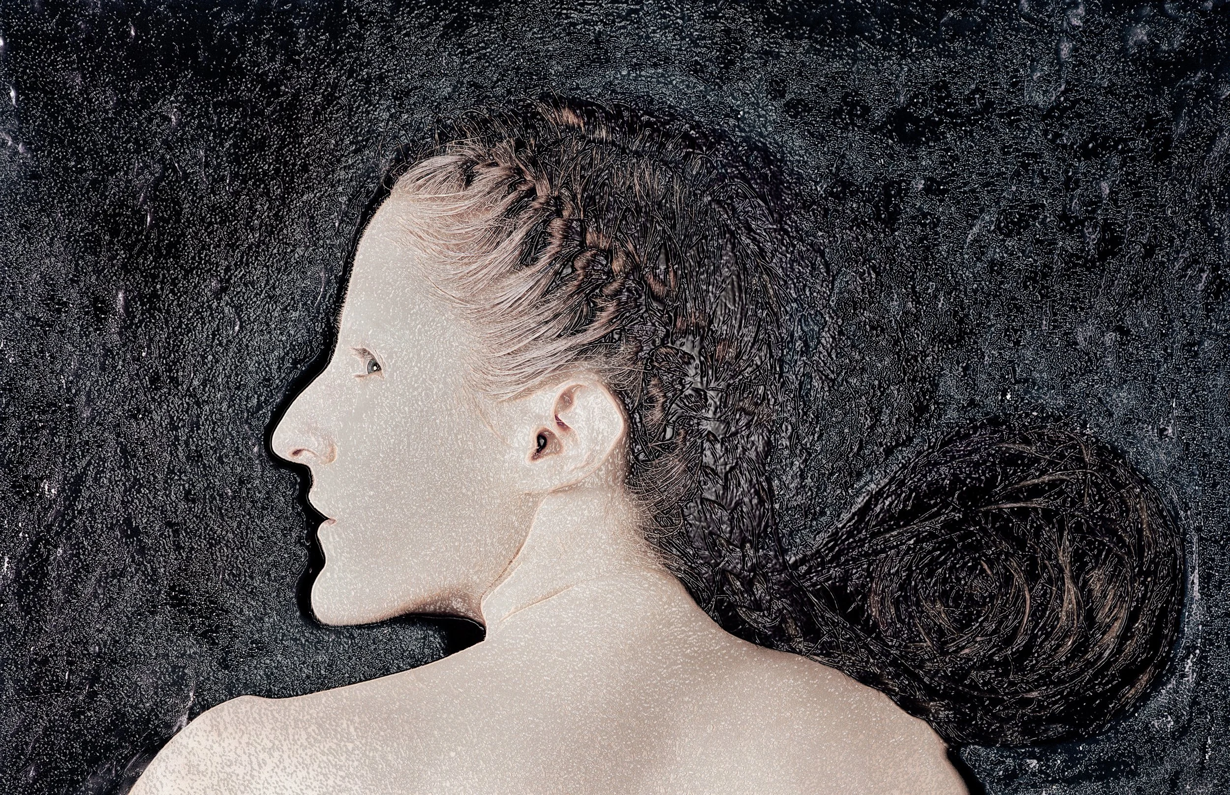 Artistic depiction of a woman’s profile with long flowing hair, blending into a dark textured background.