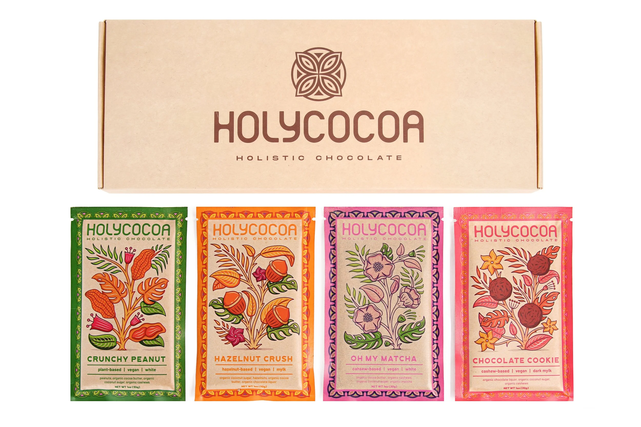 A box labeled "Holycoca Holistic Chocolate" with four colorful chocolate bars featuring botanical illustrations, each with different flavors like crunchy peanut, hazelnut crush, oh my matcha, and chocolate cookie.