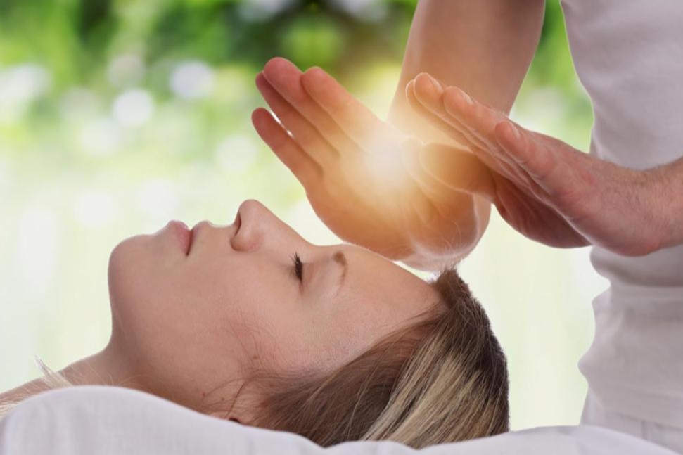 Reiki hands with client.png (Copy)