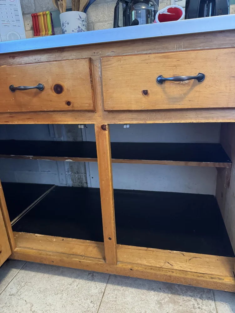 After: cabinet built out with new shelves and liners
