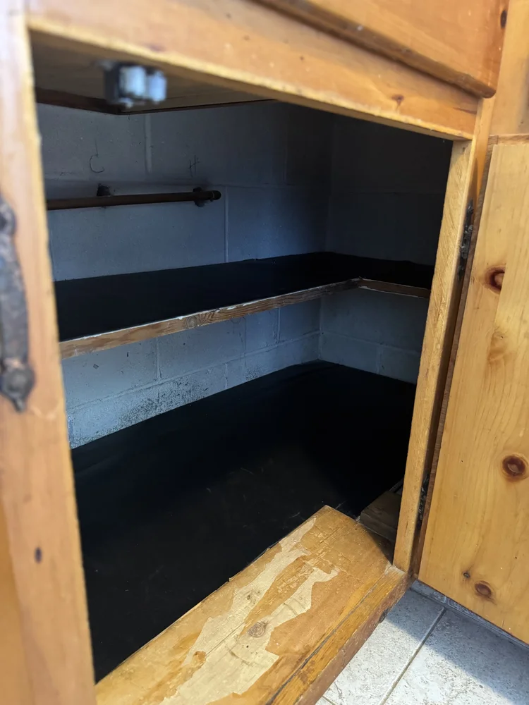 After: cabinet with new shelving installed