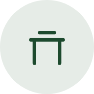 Green torii gate icon inside a light gray circle