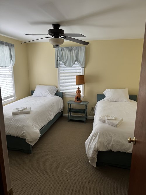 After: twin bedroom made up for the next guests