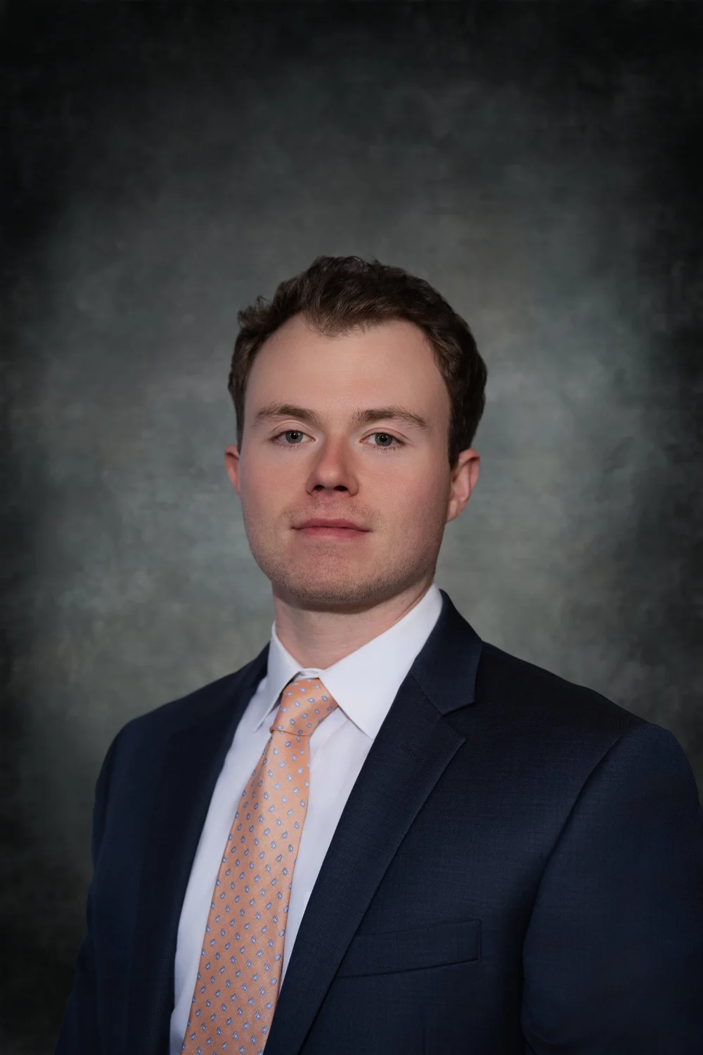 Matt Trymbulak, owner of TRM Property Maintenance serving Westerly and South County, RI, in a navy suit