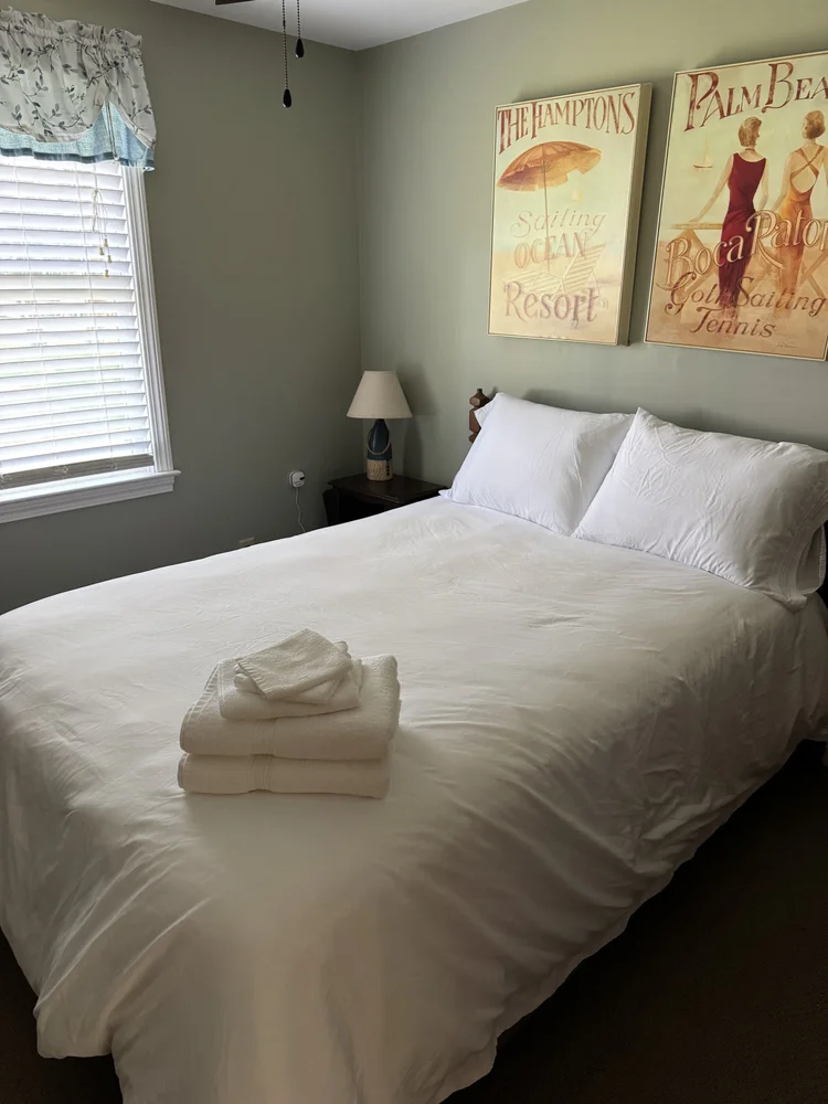 After: guest room reset with fresh linens and towels