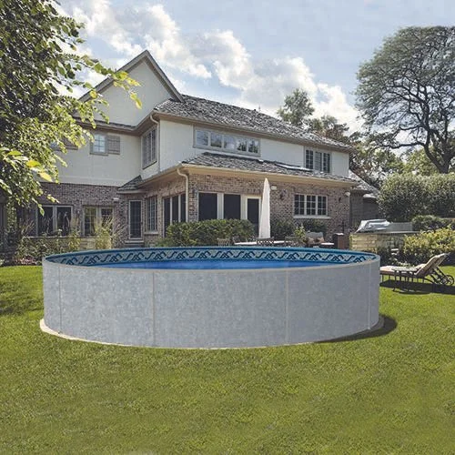 A backyard with a round above-ground swimming pool, a lawn chair, and a large two-story house with brick and white siding.