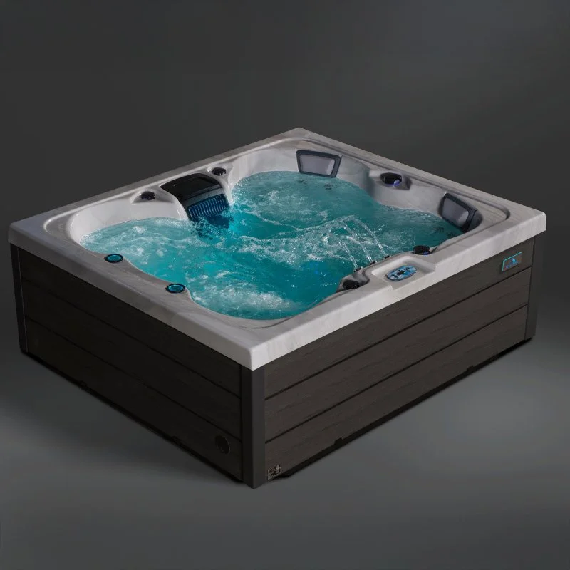 A rectangular hot tub with blue water, built-in seats, jets, and control panel, featuring a wood-panel exterior.