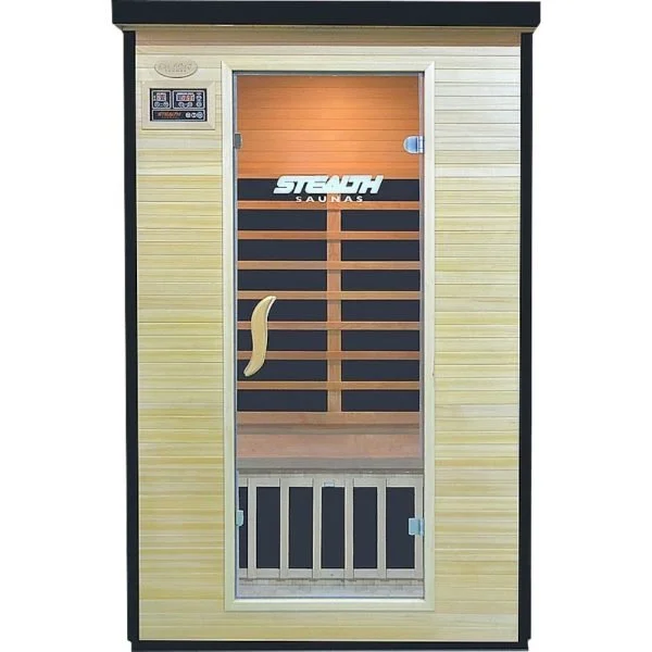 A sauna room with a glass door, wooden interior, and a control panel outside. The sauna is labeled 'STEAM SAUNAS' on the door.