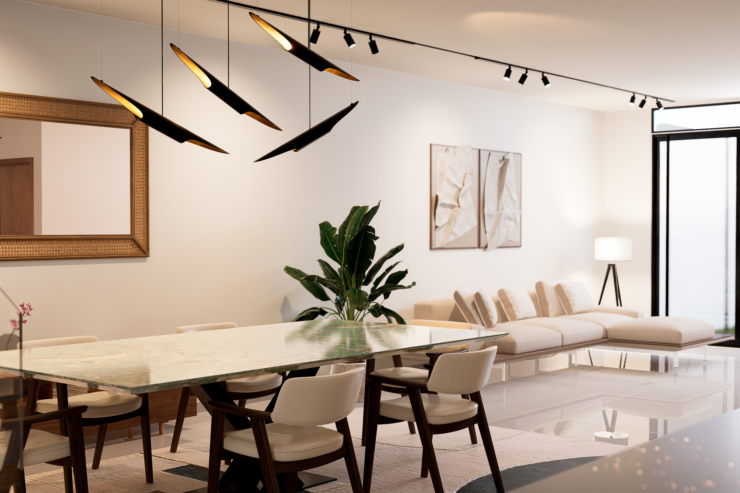 El comedor se concibe no solo como un área funcional, sino como el corazón de la vivienda, diseñado para fomentar la interacción social. Las texturas juegan un papel crucial: el contraste entre superficies frías y la calidez de la madera y las telas 