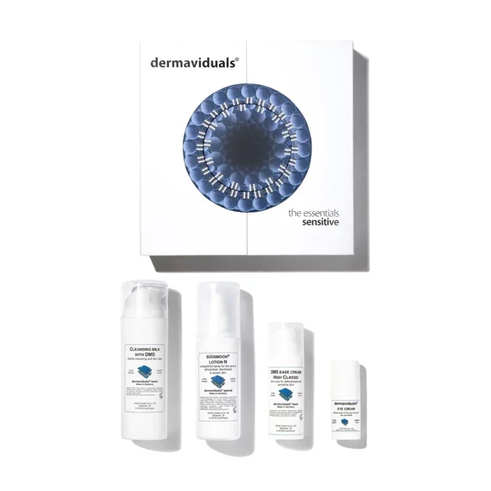 Skin care products from dermaviduals, including cleansing milk, soothing lotion, DMS base cream, and eye cream, arranged in front of a white box with blue circular design.