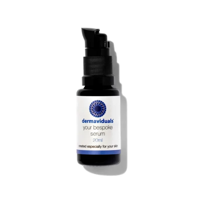A black bottle with a pump dispenser labeled 'dermaviduals your bespoke serum 20ml created especially for your skin' against a white background.