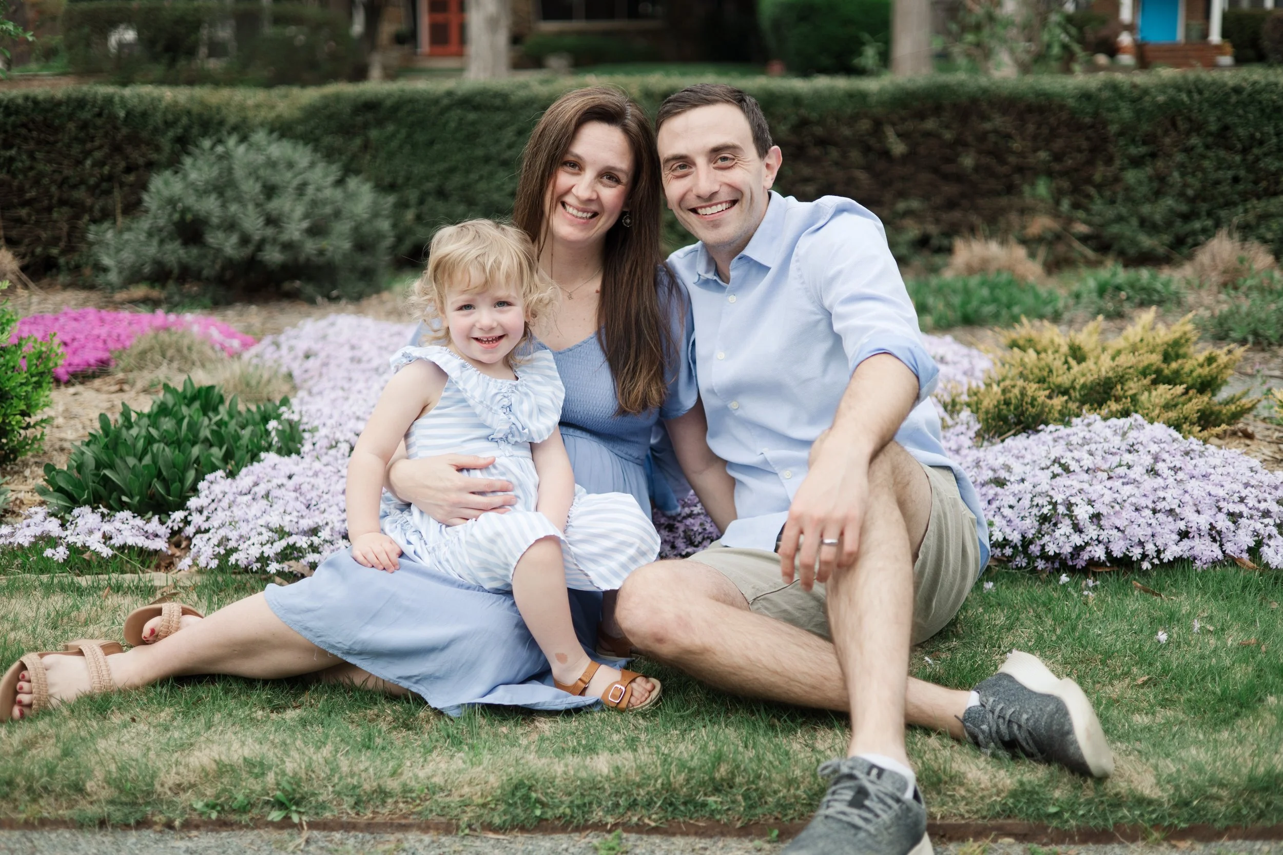Happy Family Sitting and Smiling During Maternity Photo Session in Charlotte, North Carolina