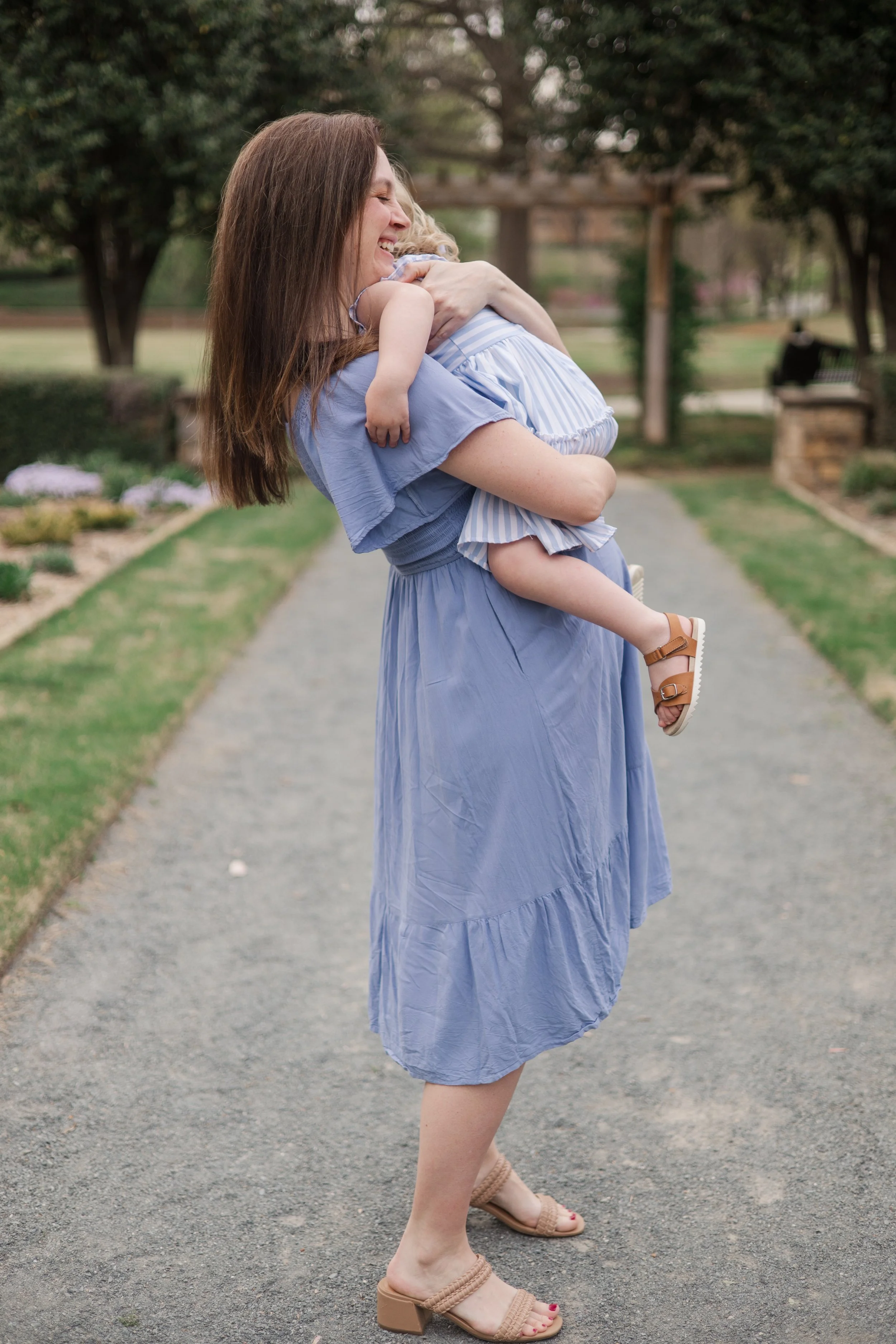 maternity photoshoot toddler hugging expectant mother