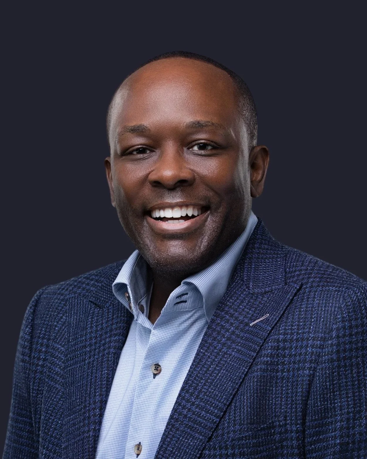 Smiling businessman in a navy suit, professional headshot in Fishers, Indiana by Square Mouth Studios