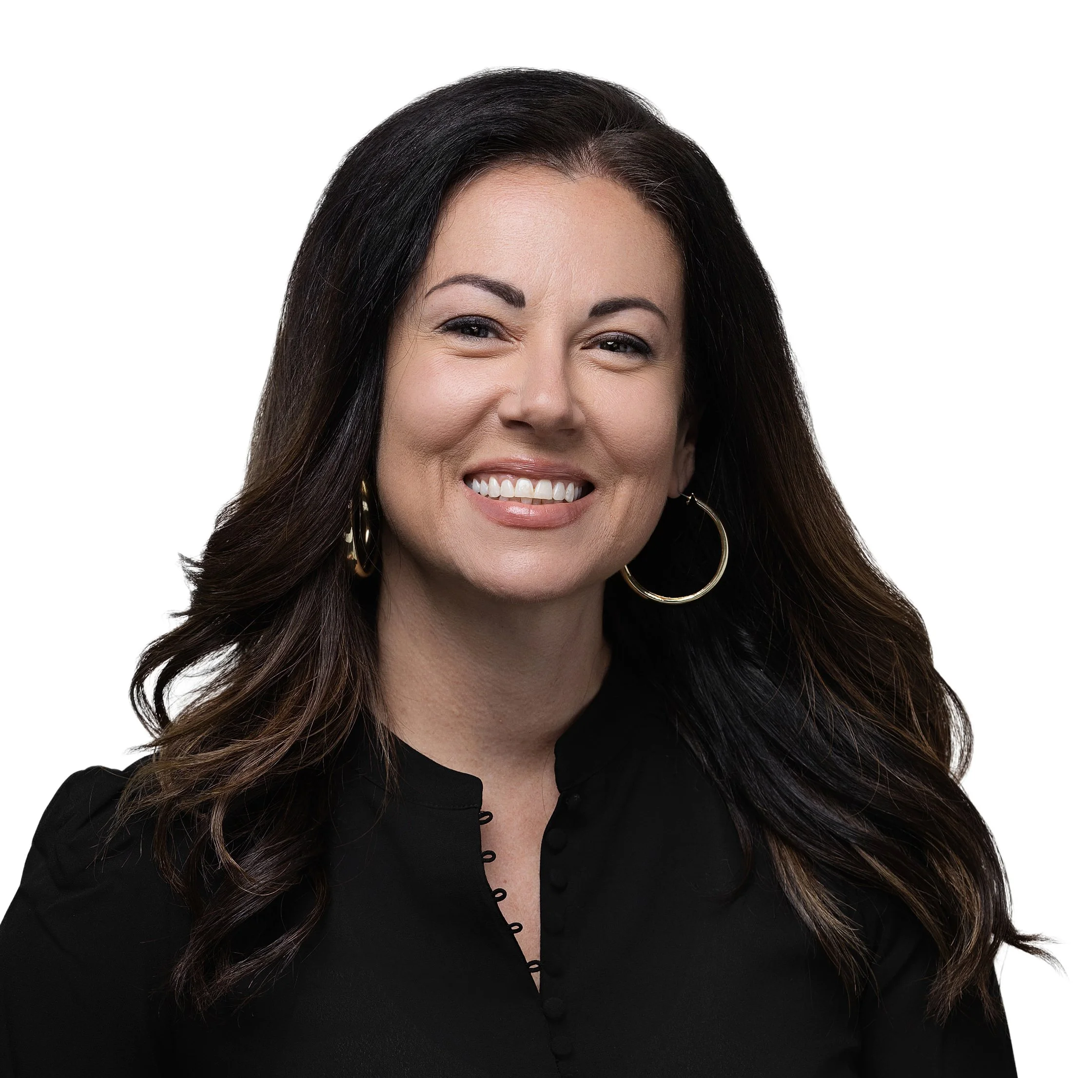Smiling woman with long dark wavy hair in a black top, professional headshot