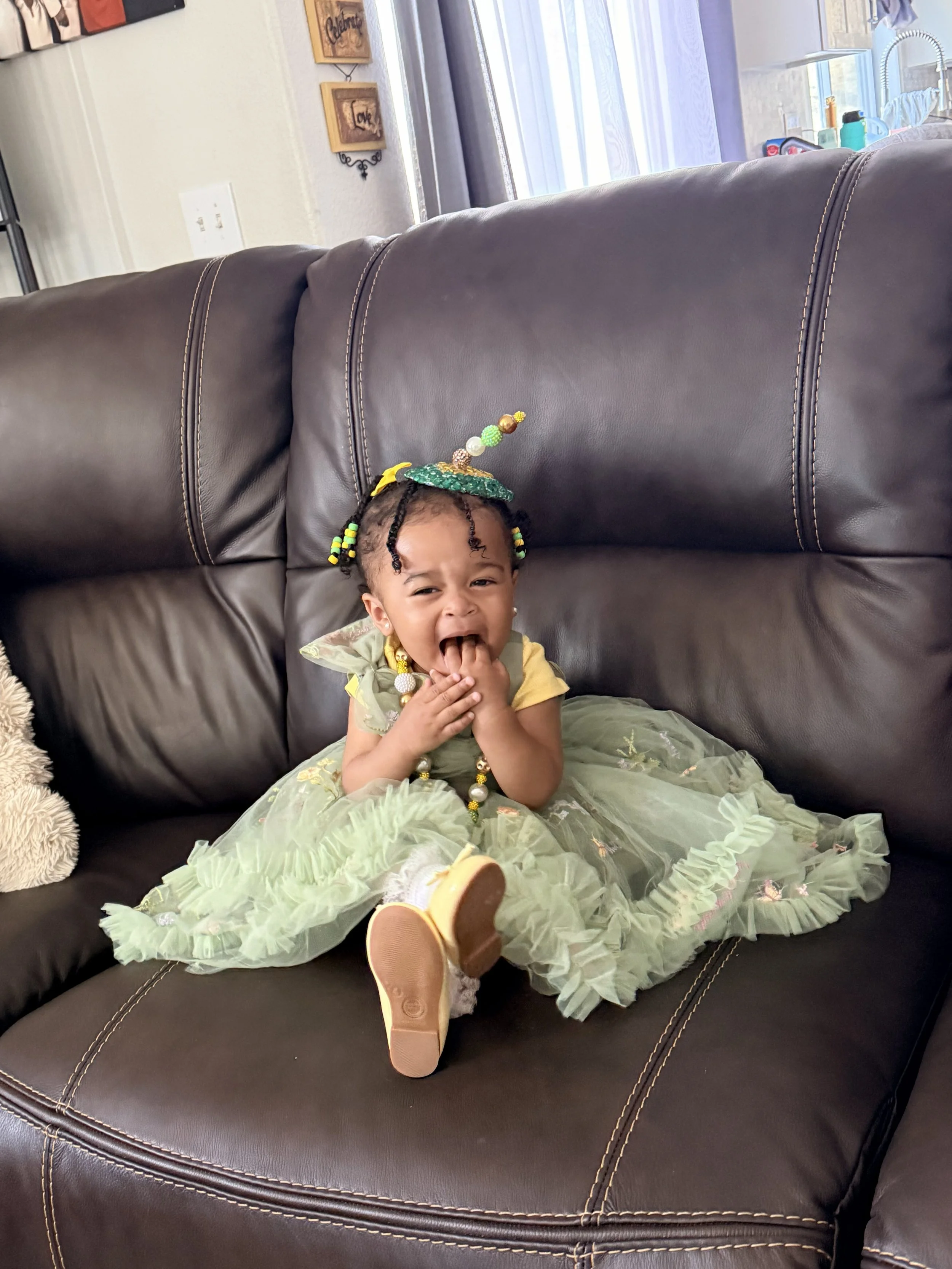 Green Fascinator on Baby.jpeg